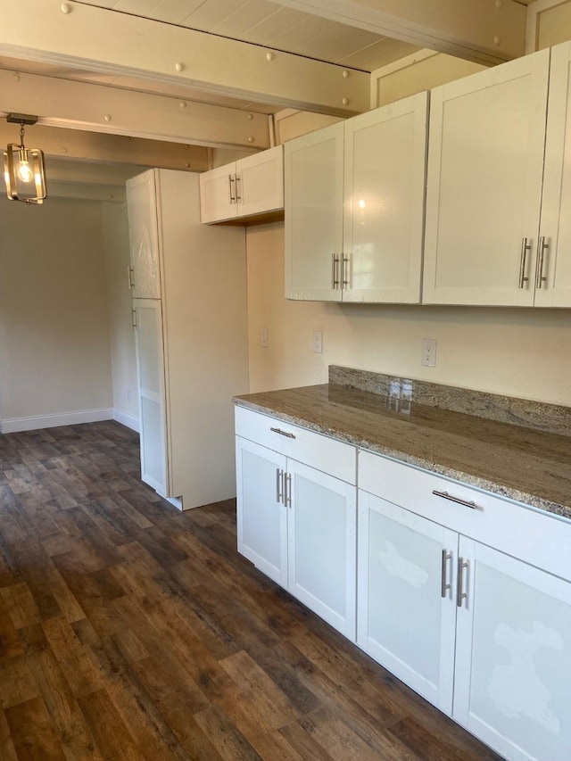 kitchen featuring white cabinets and dark hardwood / wood-style floors