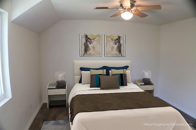 bedroom featuring dark wood-type flooring, ceiling fan, and lofted ceiling