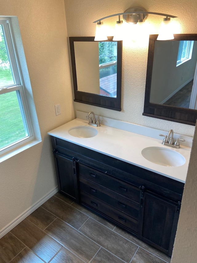 bathroom with vanity and a wealth of natural light