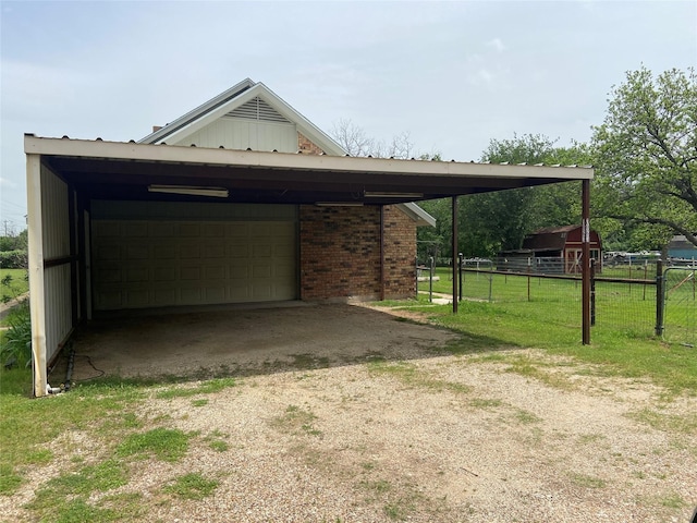 exterior space with a front lawn and a carport