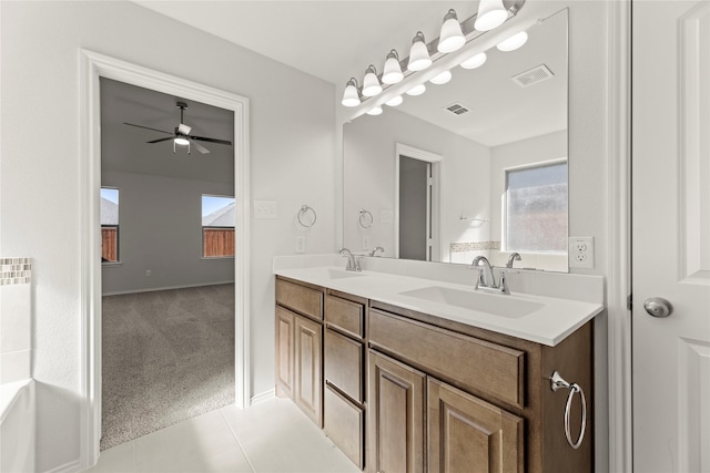 bathroom with ceiling fan, tile patterned flooring, and vanity