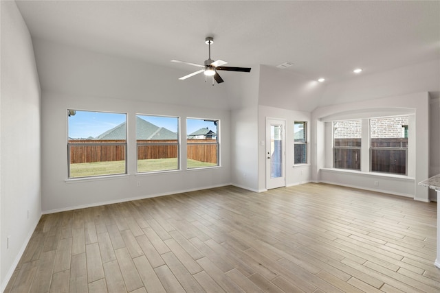 interior space featuring light hardwood / wood-style flooring, vaulted ceiling, and ceiling fan