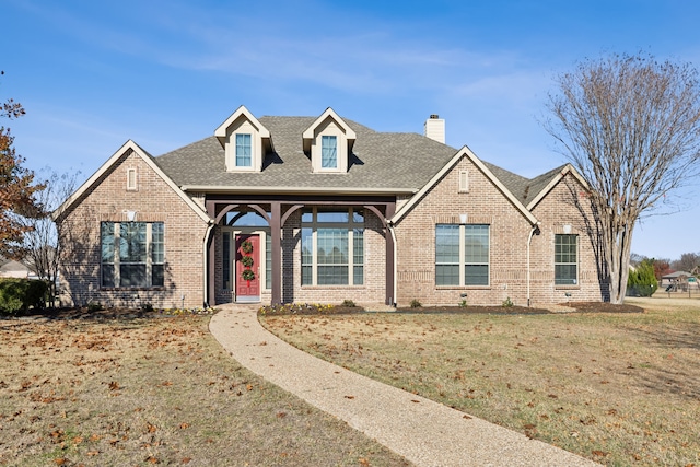 view of front of home with a front yard