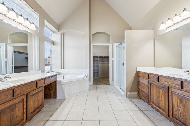 bathroom with tile patterned floors, separate shower and tub, and vanity