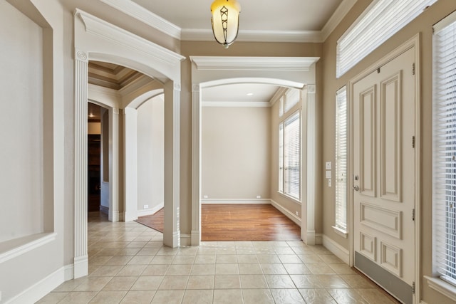 foyer entrance featuring light hardwood / wood-style flooring and crown molding