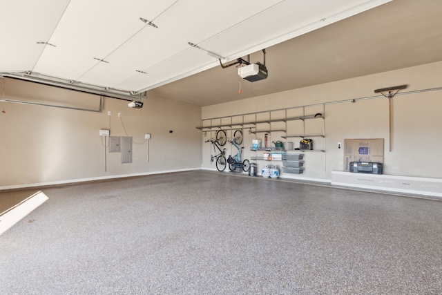 garage featuring electric panel and a garage door opener