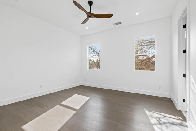 unfurnished bedroom featuring ceiling fan and dark wood-type flooring