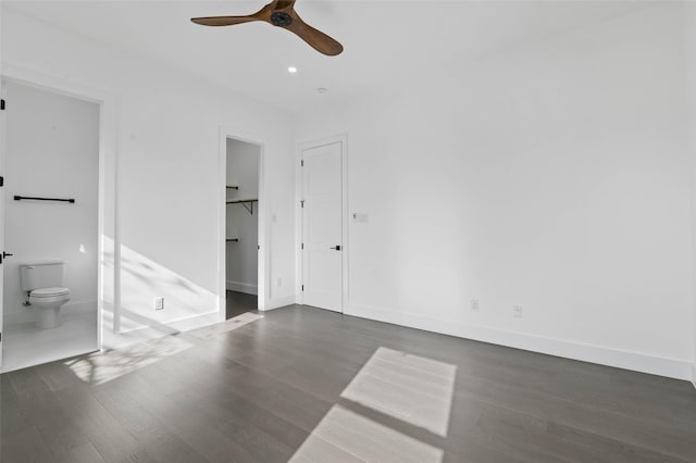 unfurnished room featuring dark hardwood / wood-style floors and ceiling fan