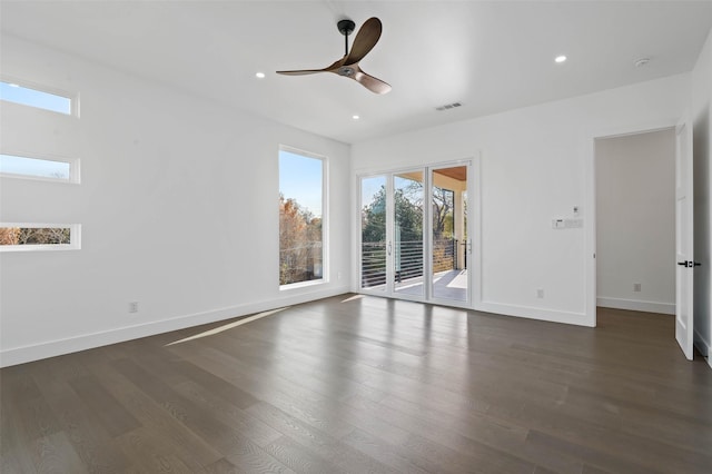 unfurnished room featuring ceiling fan and dark hardwood / wood-style floors