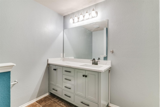 bathroom with tile patterned floors and vanity