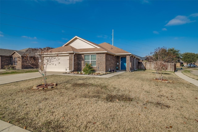 single story home featuring a garage and a front lawn