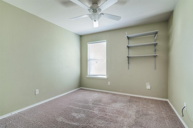 carpeted empty room with ceiling fan