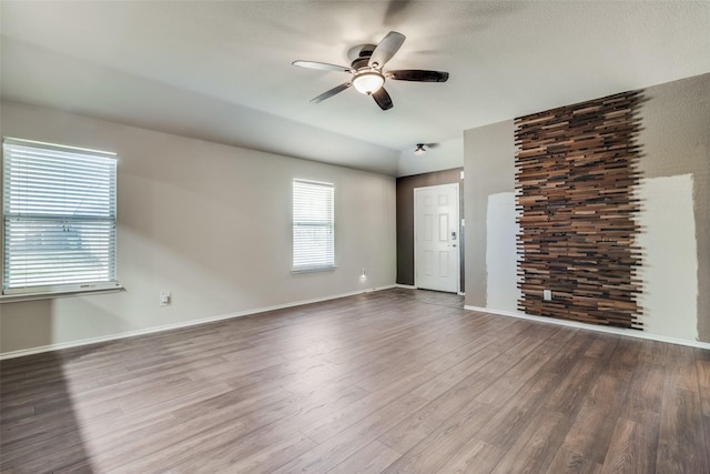 spare room featuring hardwood / wood-style flooring and ceiling fan