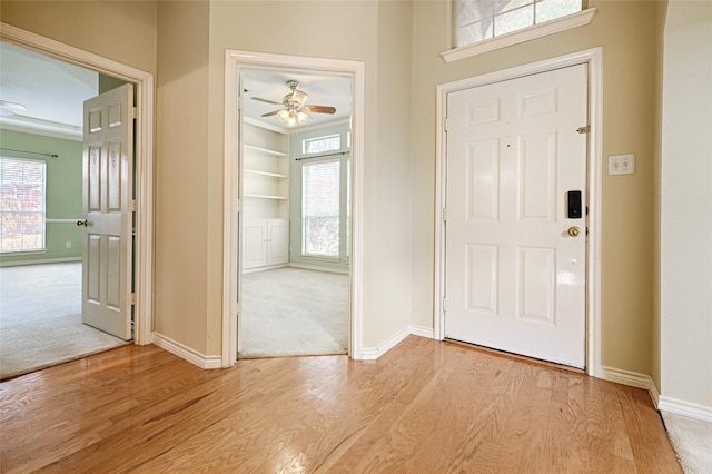 entryway featuring ceiling fan and light hardwood / wood-style floors