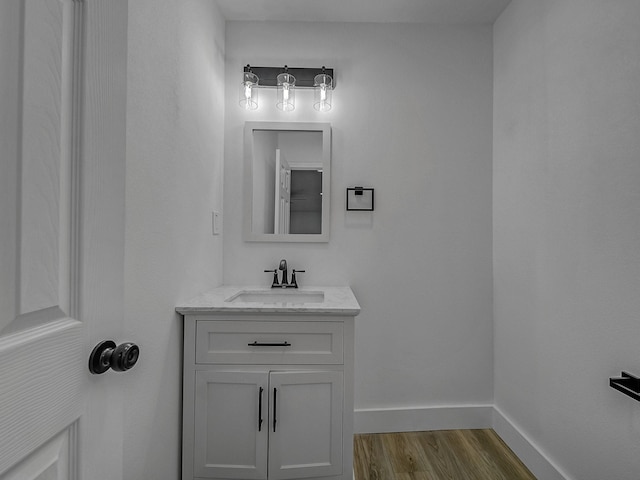 bathroom featuring hardwood / wood-style flooring and vanity