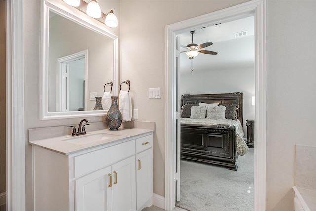 bathroom featuring ceiling fan and vanity