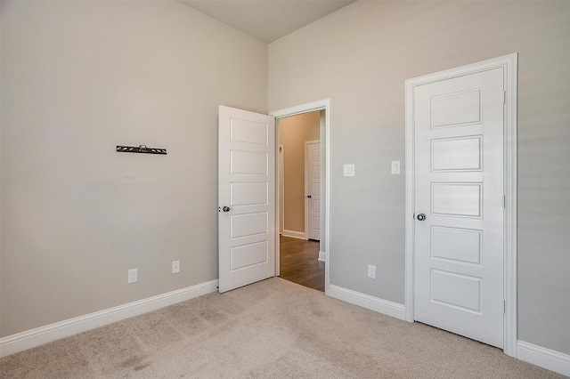 unfurnished bedroom with light carpet