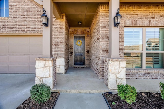 view of exterior entry featuring a garage