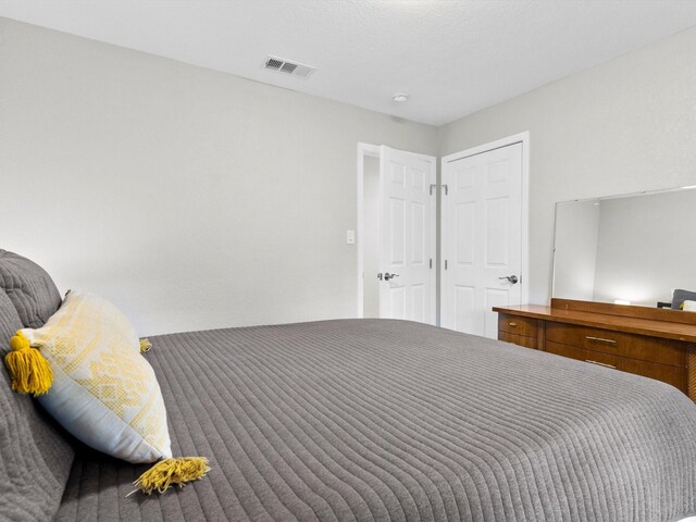 bedroom featuring a textured ceiling