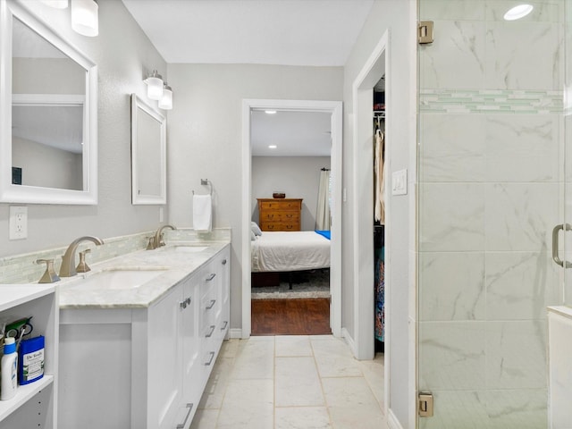 bathroom with vanity, wood-type flooring, and an enclosed shower