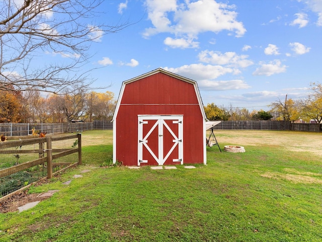 view of outbuilding with a yard