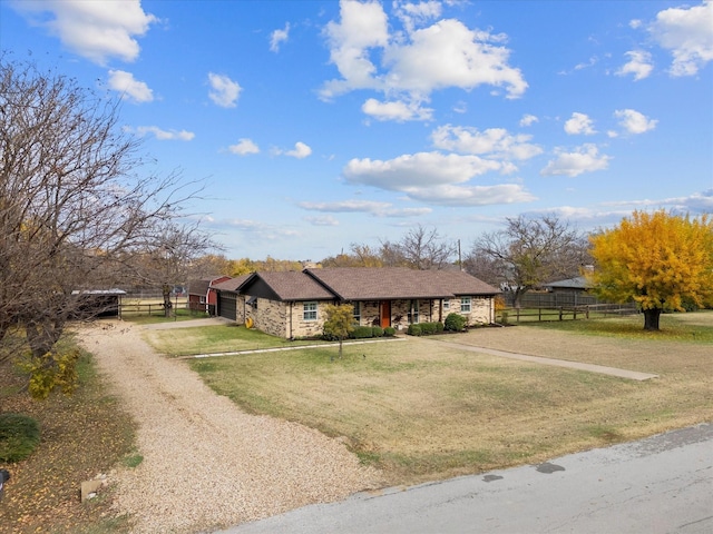 ranch-style house with a front yard