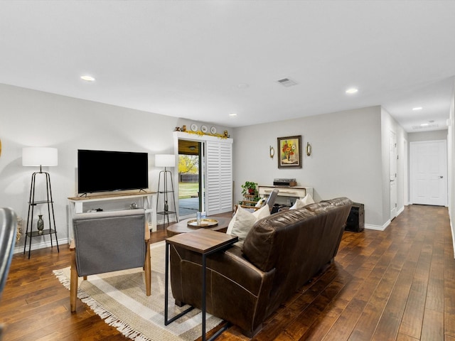 living room featuring dark wood-type flooring