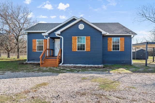 view of front facade featuring a storage shed