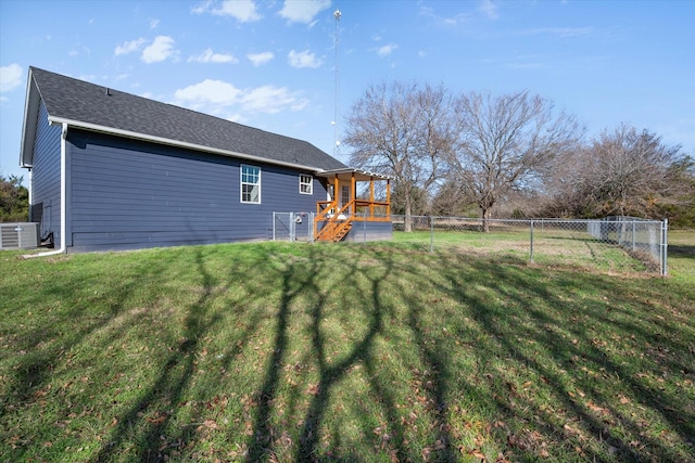 view of yard featuring a wooden deck and central air condition unit