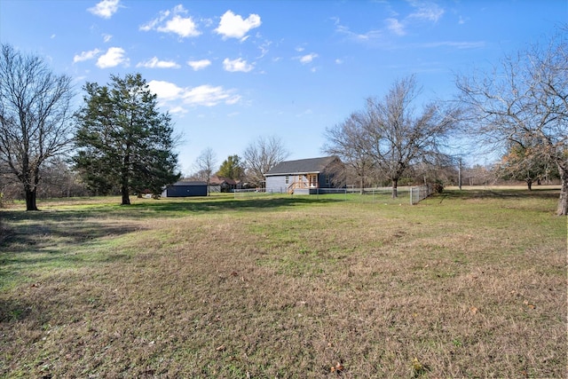 view of yard with a rural view