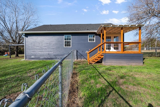 back of house with a yard