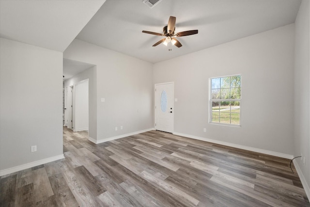 empty room featuring ceiling fan and light hardwood / wood-style flooring