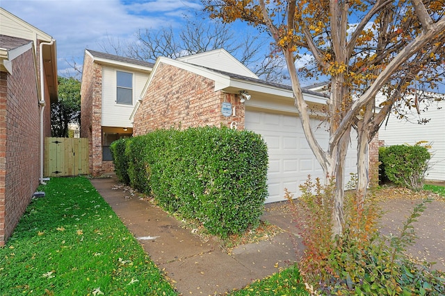 view of side of home with a garage