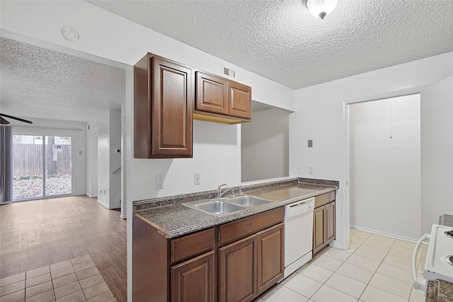 kitchen featuring ceiling fan, dishwasher, sink, light wood-type flooring, and range