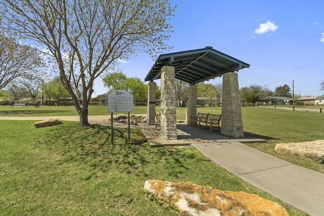 view of home's community with a lawn and a gazebo