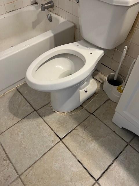 bathroom featuring tile patterned floors and toilet