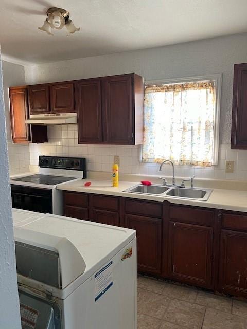 kitchen featuring white electric range oven, decorative backsplash, and sink