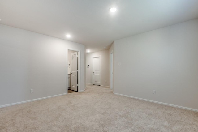 empty room featuring light carpet