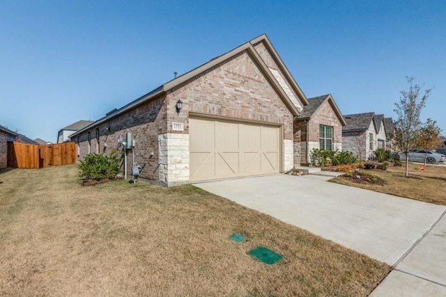 view of front of property with a front yard and a garage