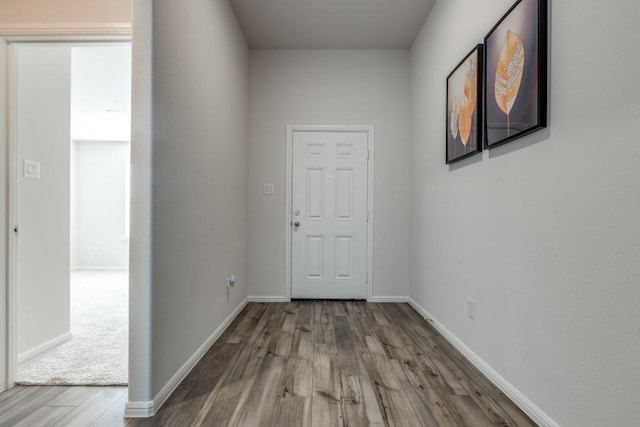 hall with hardwood / wood-style flooring