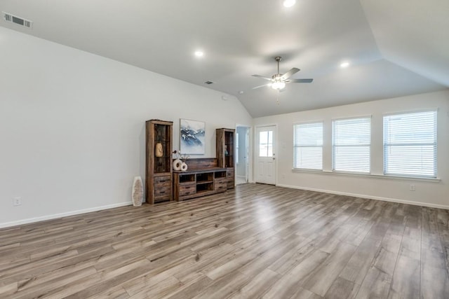 unfurnished living room featuring light hardwood / wood-style floors, ceiling fan, and lofted ceiling