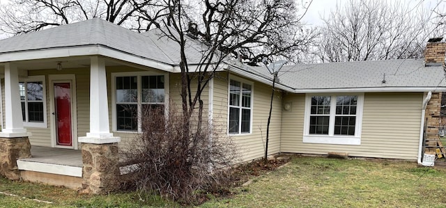 view of side of property featuring a yard