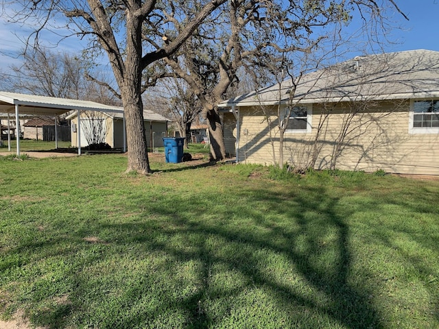 view of yard with a carport