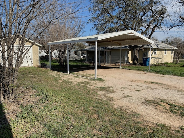 view of yard with a carport