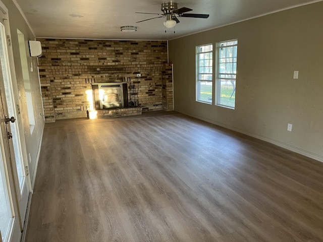 unfurnished living room with ceiling fan, a fireplace, and hardwood / wood-style flooring