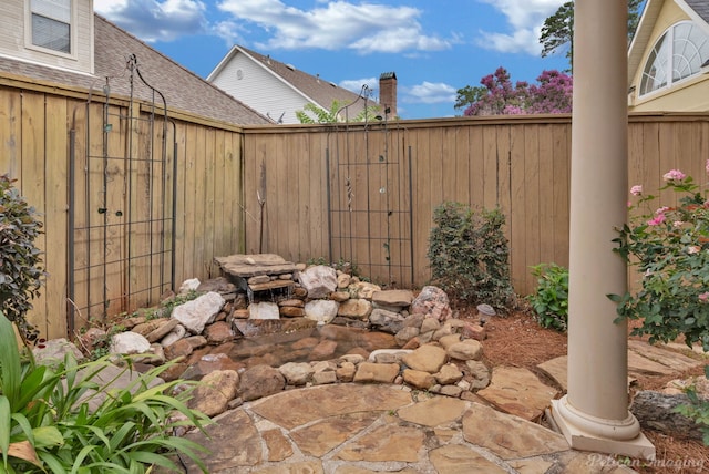 view of patio featuring fence