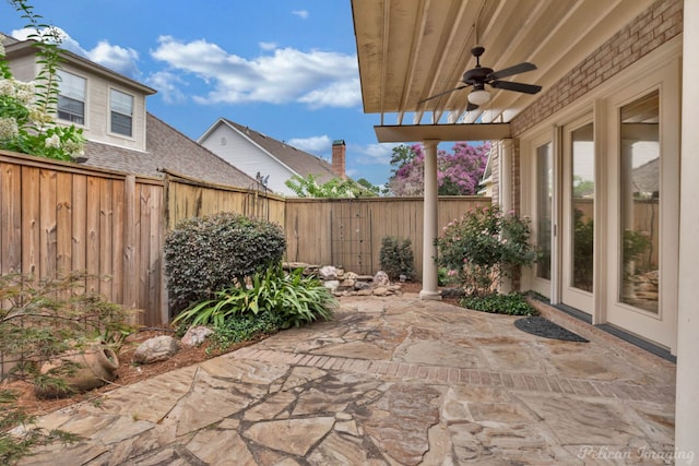 view of patio with a ceiling fan and a fenced backyard