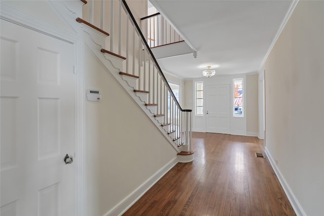 1102 Howell St, Mckinney, TX 75069 - entrance foyer featuring wood finished floors, stairway, and crown molding