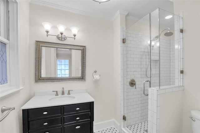 full bath featuring toilet, vanity, baseboards, ornamental molding, and a shower stall