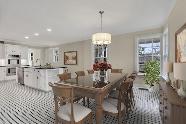 dining room featuring recessed lighting, visible vents, baseboards, ornamental molding, and an inviting chandelier